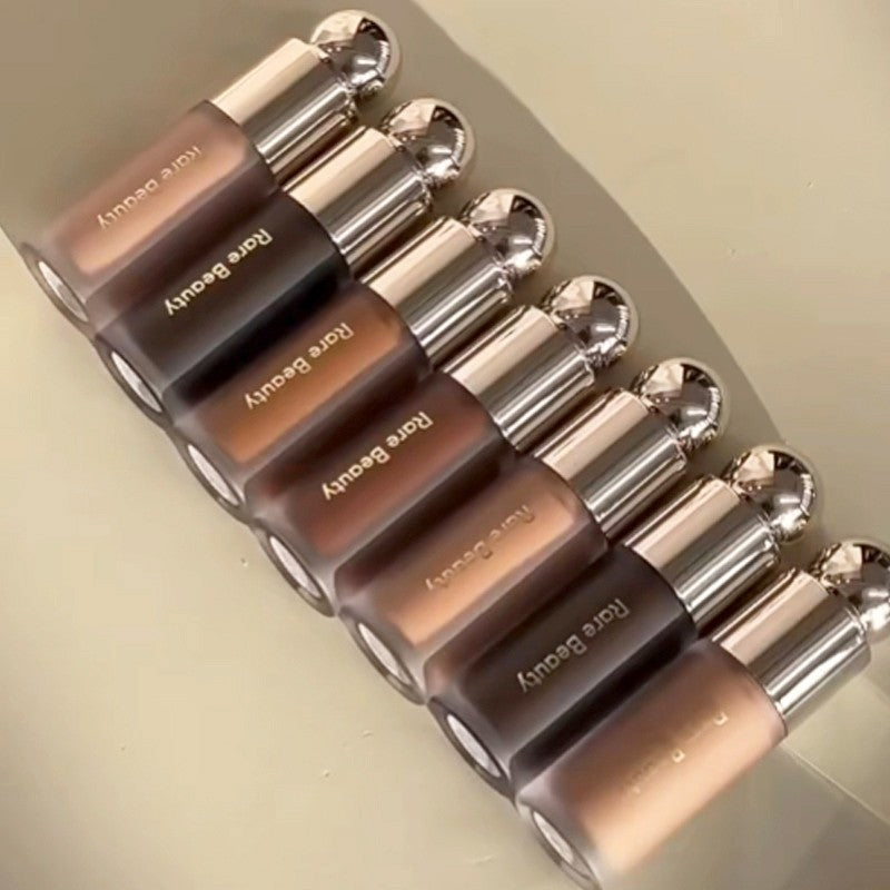 Iluminador e Bronzer Líquido Rare Beauty – Glow Intenso e Contorno Natural